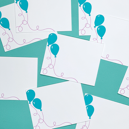 An image of several  flat cards featuring balloons