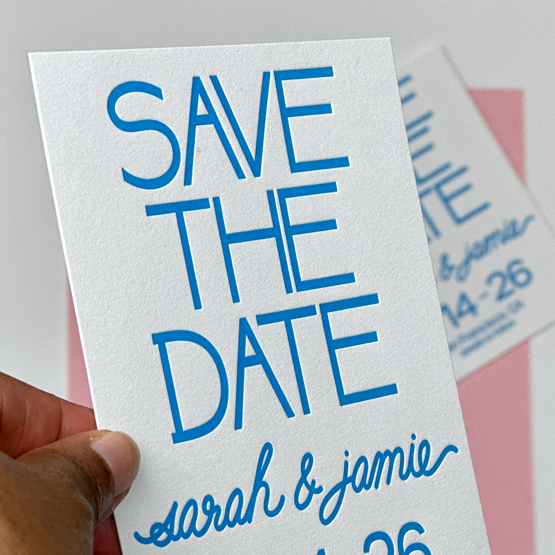 Modern Save the Date being held in someone's hand