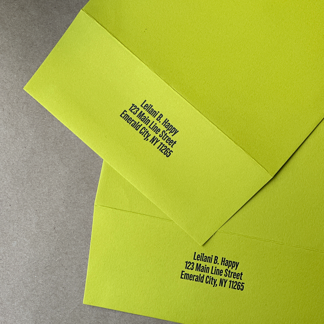 Two envelopes laying flat with a Letterpress Printed return address on each flap. 