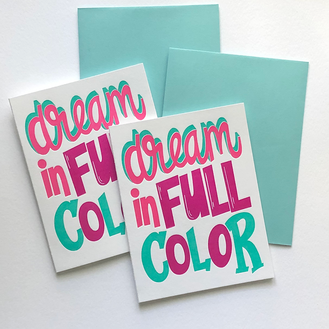 Two greeting cards with the words dream in full color and two envelopes